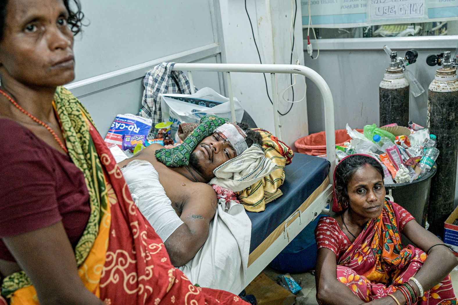 A man who was injured in a <a href="https://www.cnn.com/2023/06/03/india/india-odisha-train-crash-saturday-intl-hnk/index.html" target="_blank">deadly train crash</a> in India's Odisha state is joined by relatives as he recovers at a hospital on Saturday, June 3.