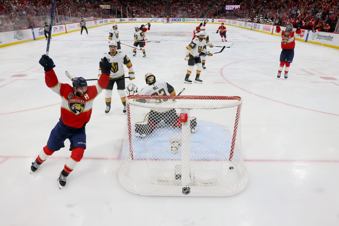 SUNRISE, FLORIDA - JUNE 08:  Adin Hill #33 of the Vegas Golden Knights allows the game-winning goal by Carter Verhaeghe #23 of the Florida Panthers during the first overtime period as Matthew Tkachuk #19 celebrates to give the Panthers a 3-2 win in Game Three of the 2023 NHL Stanley Cup Final at FLA Live Arena on June 08, 2023 in Sunrise, Florida. (Photo by Bruce Bennett/Getty Images)