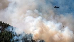 A helicopter waterbomber flies above the Cameron Bluffs wildfire near Port Alberni, British Columbia, Canada, on Tuesday, June 6, 2023. Canada is on track to see its worst-ever wildfire season in recorded history if the rate of land burned continues at the same pace. Photographer: James MacDonald/Bloomberg