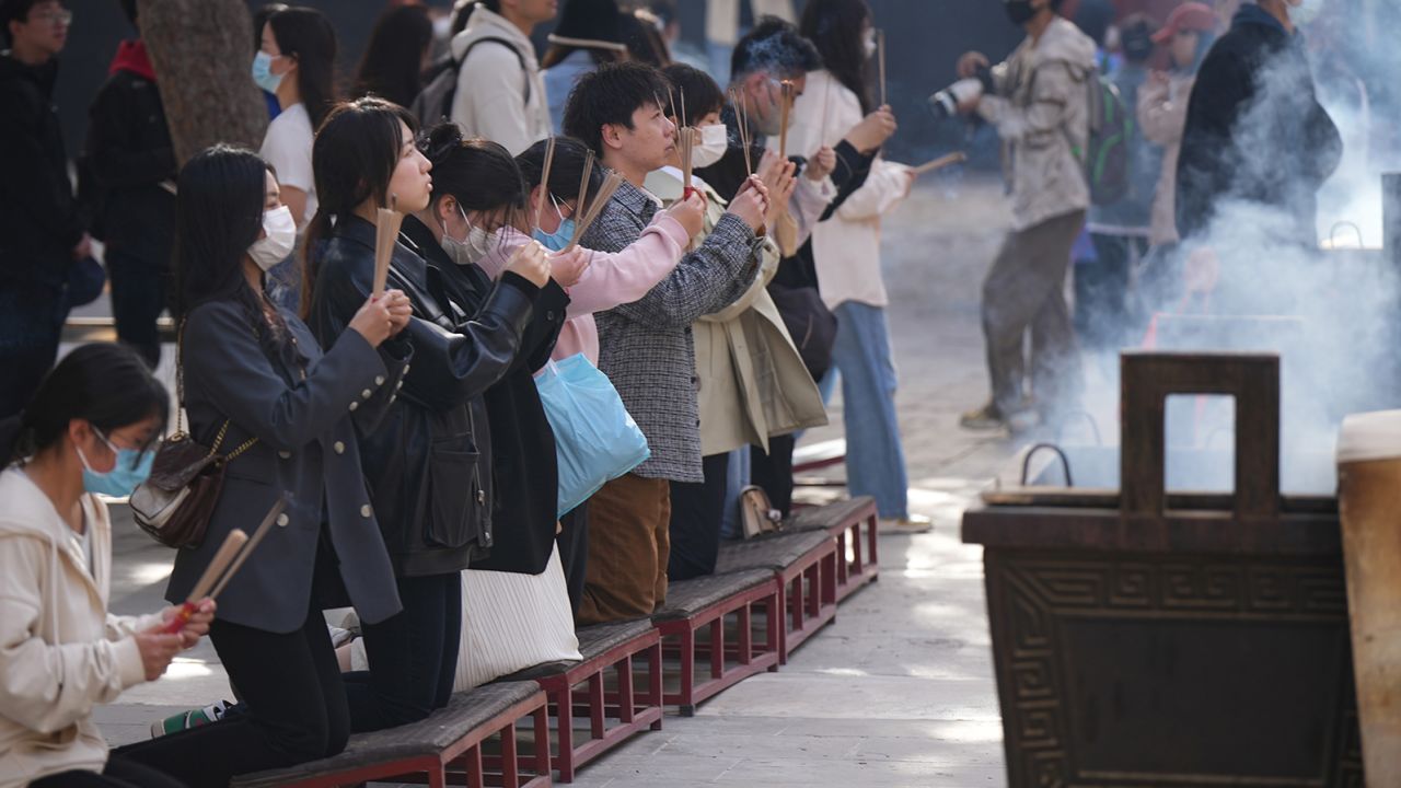 Visitors to the Yonghe Temple in April 2023.