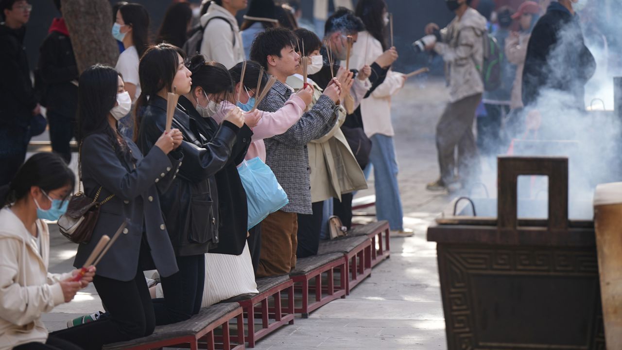 Visitors to the Yonghe Temple in April 2023. 