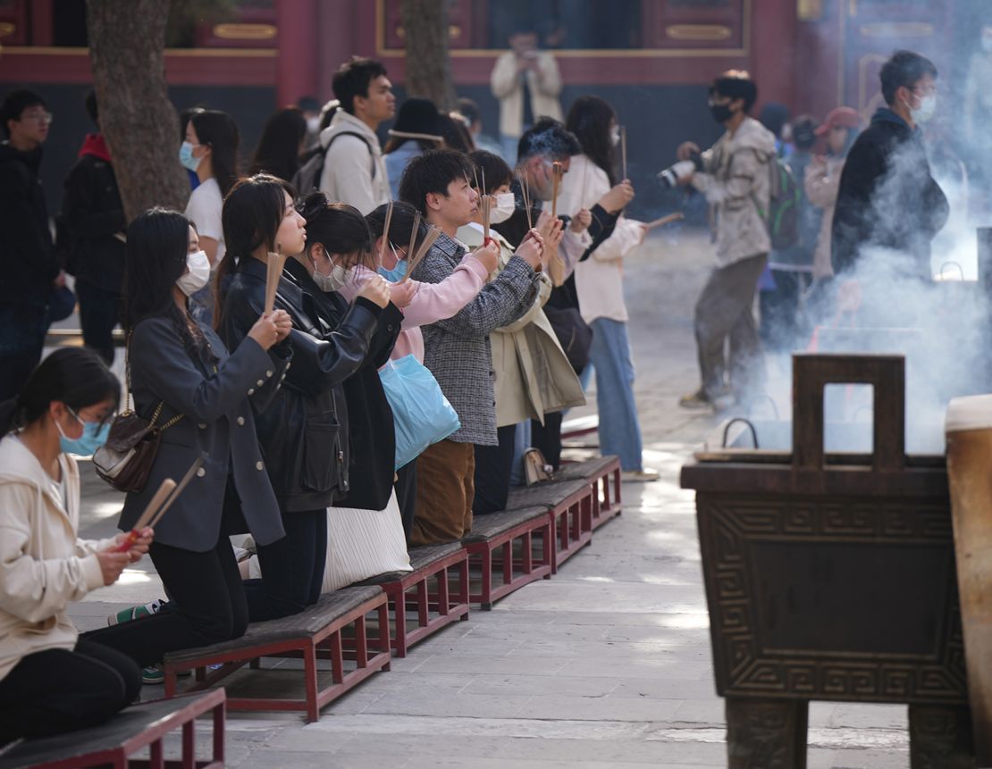 Visitors to the Yonghe Temple in April 2023. 