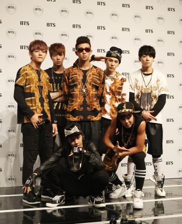 BTS poses for photographs just days after the band's official "debut day" in 2013. Scroll through the gallery to see how the K-pop group's style has evolved.