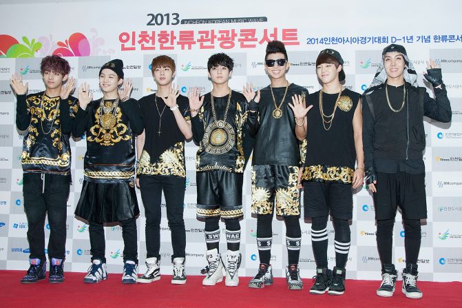BTS, then marketed as a hip-hop act, pictured at a photo call for the Incheon Korean Music Wave festival in 2013.