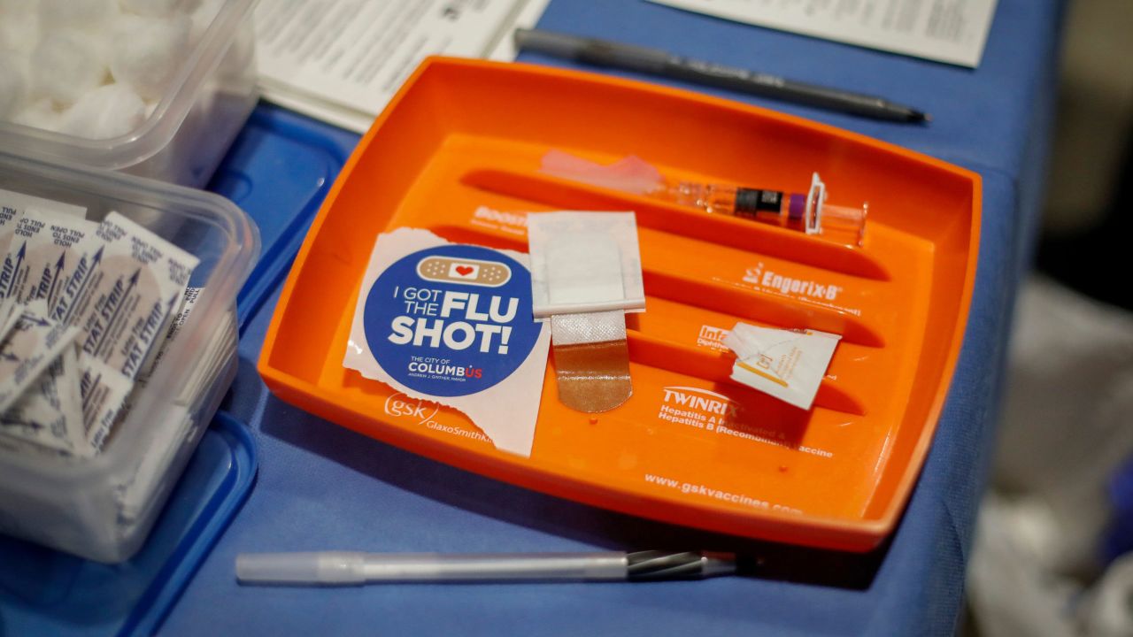 A shot and sticker awaits those in the free flu shot drive through line organized by Columbus Public Health at the Ohio State Fairgrounds in Columbus on Tuesday, Dec. 8, 2020.