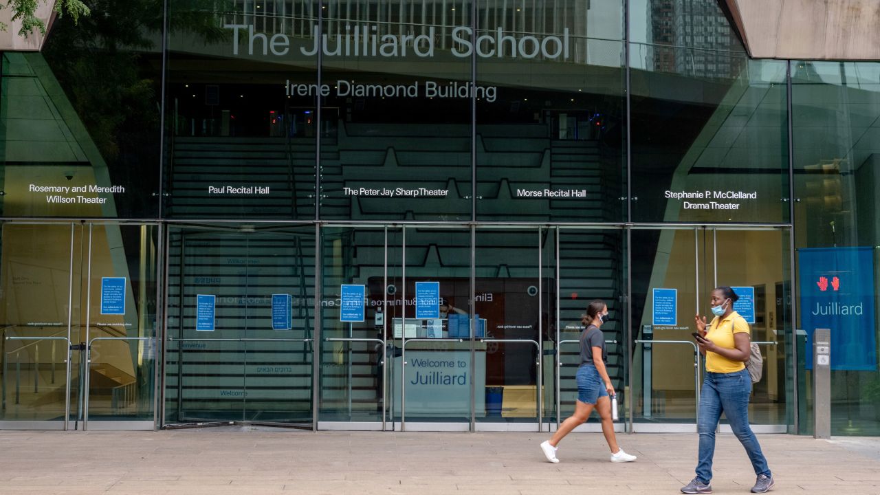 People walk past the Irene Diamond Building at The Juilliard School on August 3, 2020.
