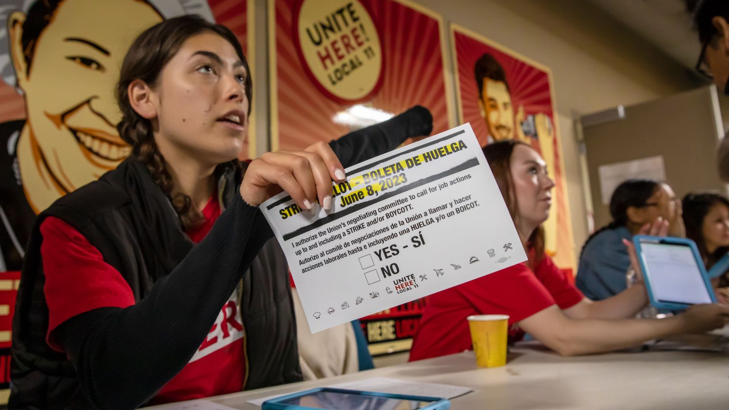 Marissa Langley attends to hotel workers coming for a strike authorization vote at the Unite Here 11 office in Los Angeles on June 8. 