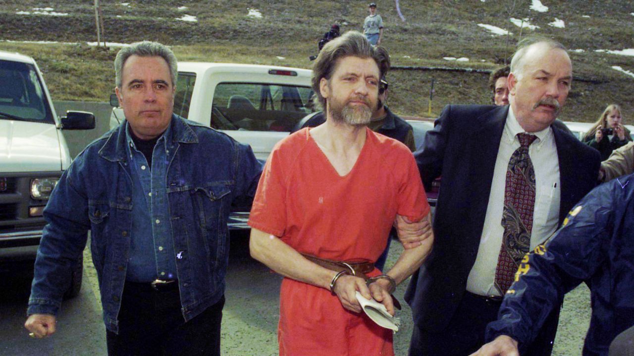  Kaczynski is escorted to his arraignment in Helena, Montana, in April 1996. 
