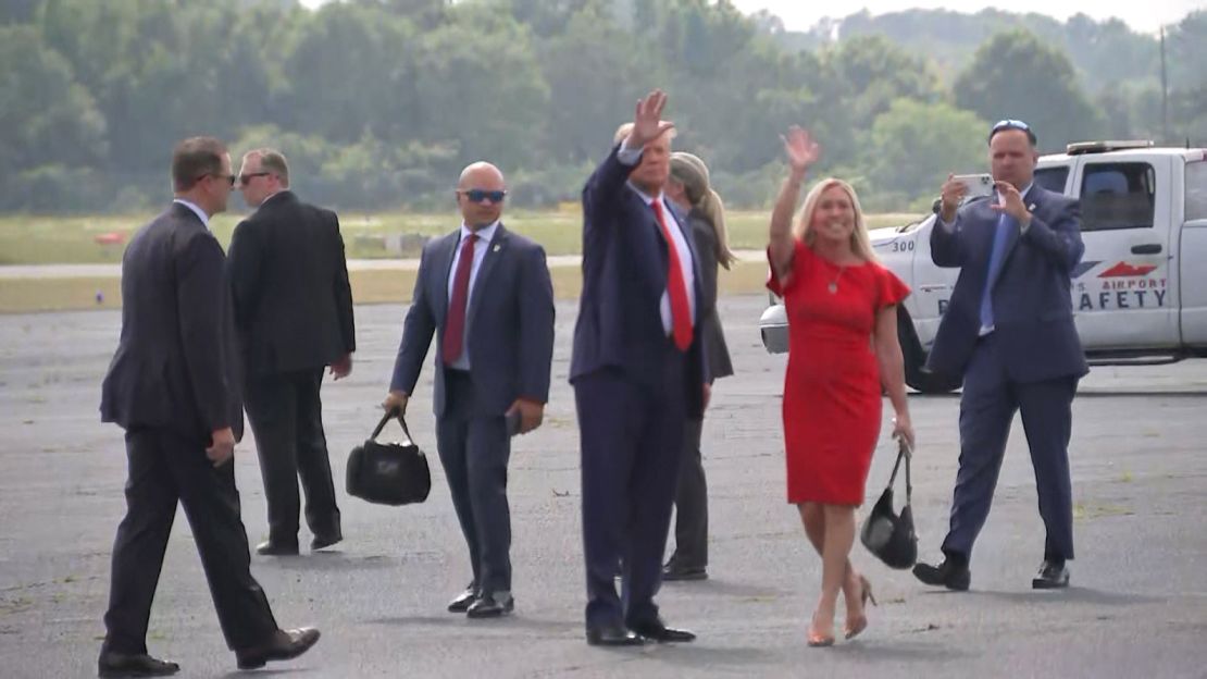 Trump aide Walt Nauta, who was indicted alongside the former president, is seen on the tarmac with Donald Trump and Rep. Marjorie Taylor Greene in Columbus, Georgia, on June 10, 2023. 