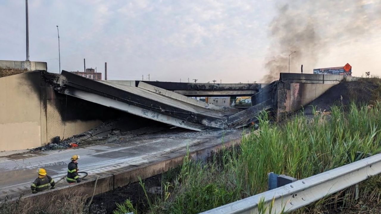 A side view shows the partial collapse of Interstate 95 after a fire underneath a Philadelphia overpass.