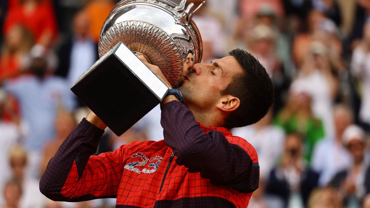 Serbia's Novak Djokovic kisses the trophy after winning the French Open.