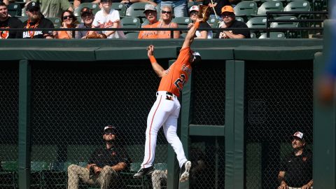 Baltimore Orioles right fielder Anthony Santander leaps up to make a catch on a fly ball by Kansas City Royals' Maikel Garcia for an out during the first inning of a baseball game, Saturday, June 10, 2023, in Baltimore.