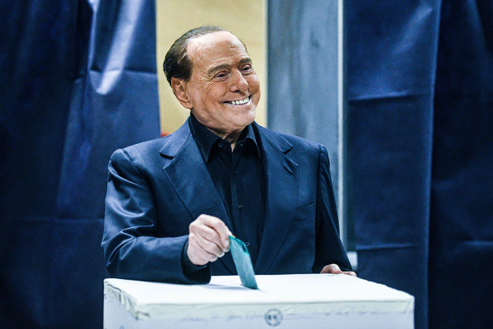 Berlusconi casts his vote during the Lombardy regional elections in Milan on February 12.
