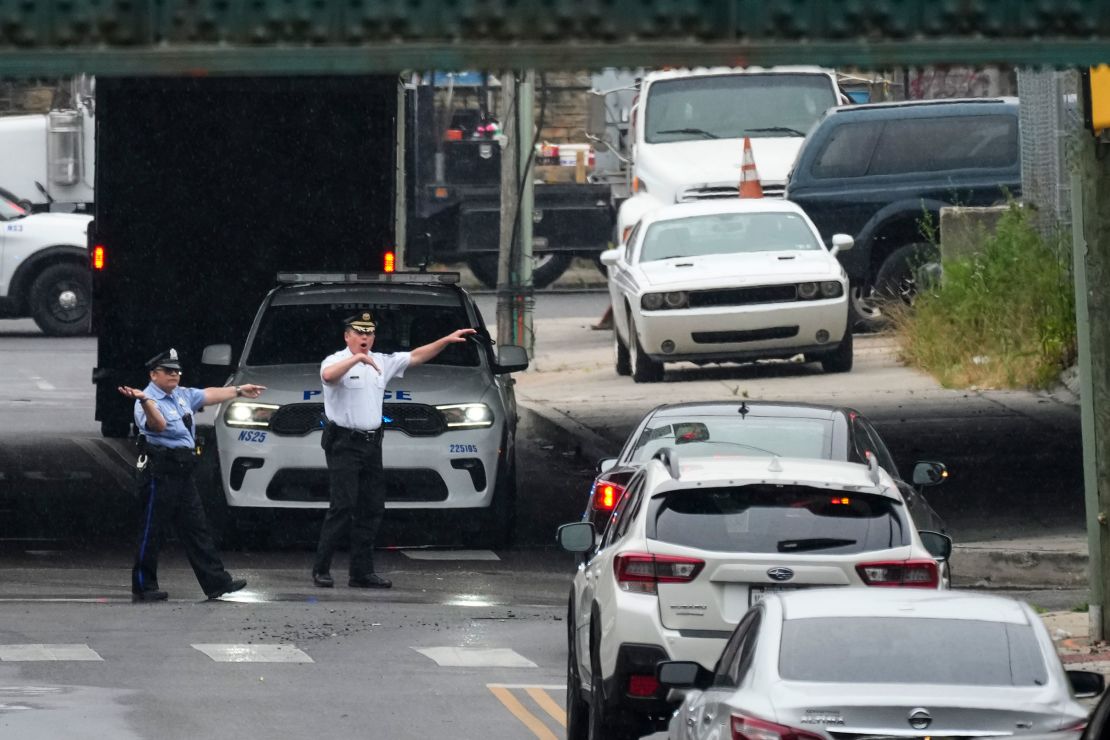 Officers direct traffic detoured in Philadelphia, Monday, June 12, 2023. 