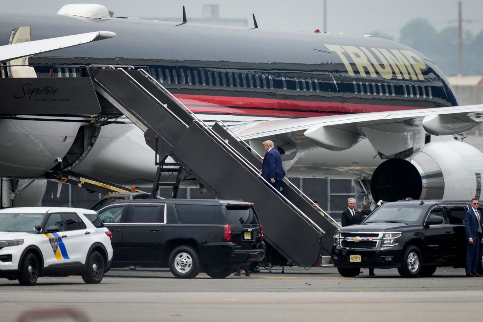 Trump boards his airplane in Newark, New Jersey, before heading to Miami.