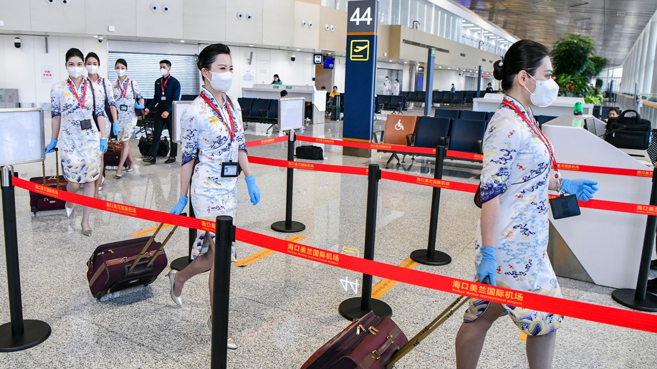 Hainan Airlines flight attendants prepare to board a plane at Haikou Meilan International Airport on March 17 in Haikou, China.