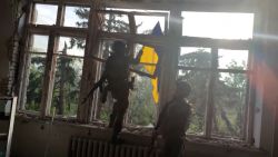 screengrab ukrainian soldier raise flag