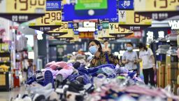 A customer purchases shoes at a supermarket on June 9, 2023 in Qingzhou, Shandong Province of China.