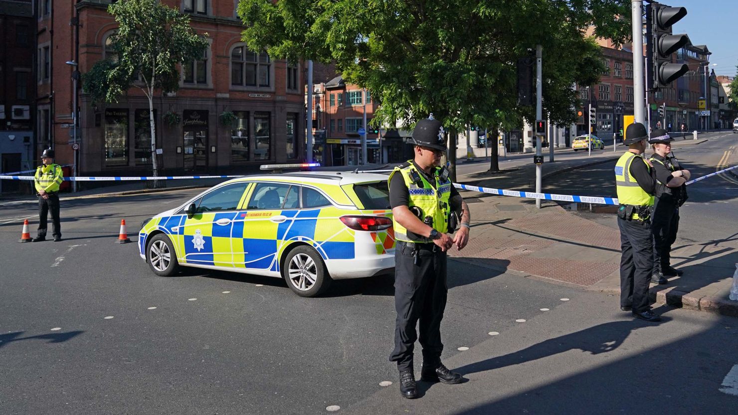 Police officers line a street in Nottingham on Tuesday, where multiple road closures were in place as authorities deal with what they called a major incident.
