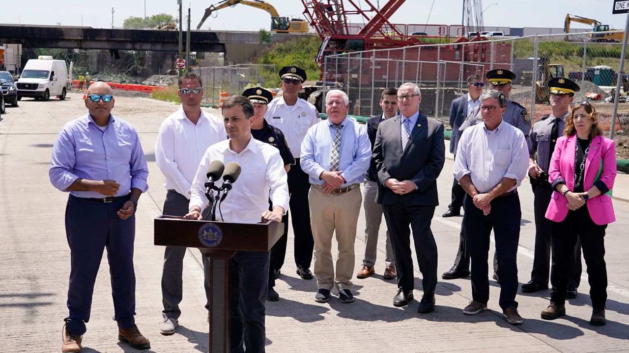 Transportation Secretary Pete Buttigieg speaks with members of the media at the scene of a collapsed section of Interstate 95 in Philadelphia on Tuesday.