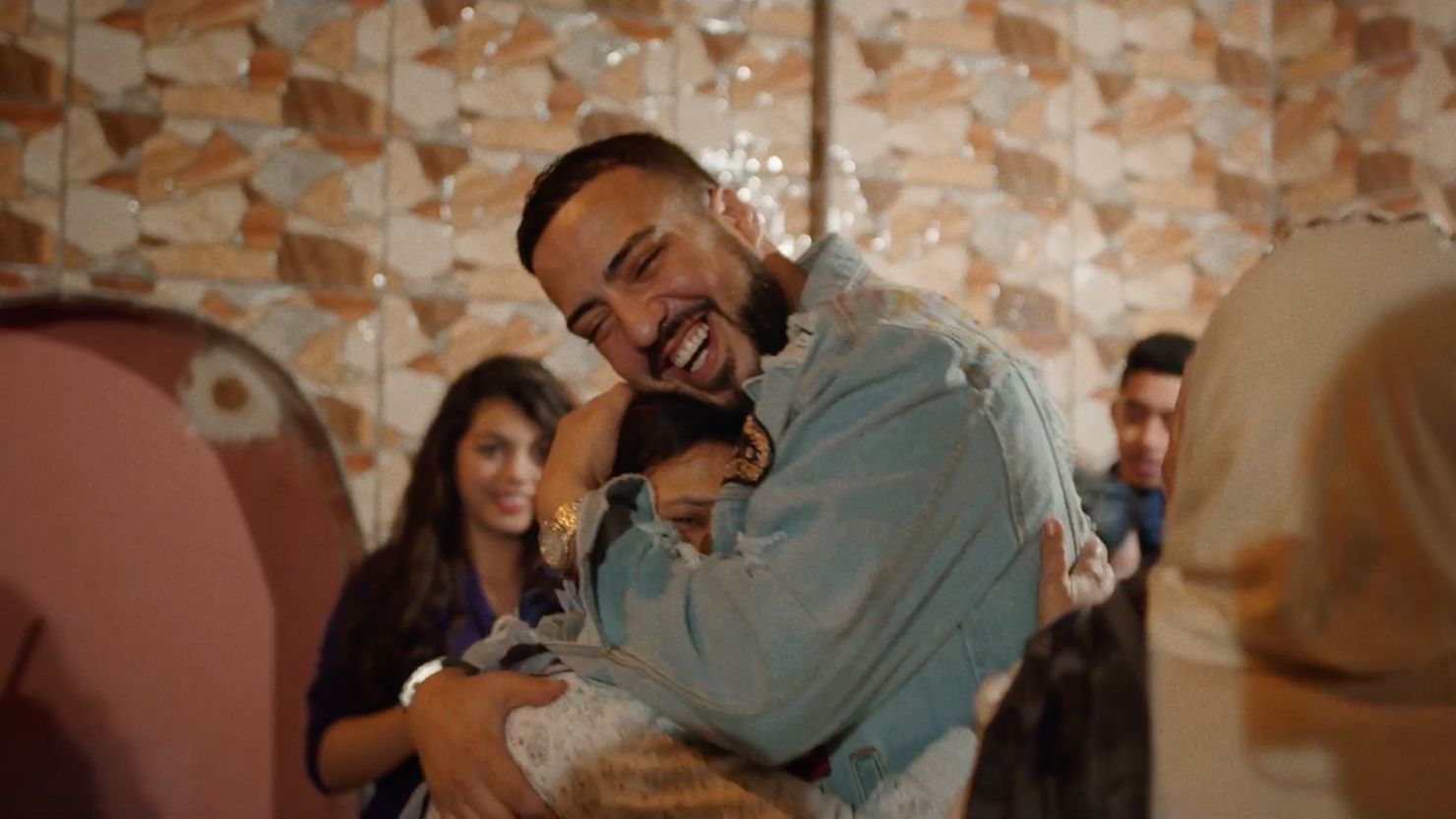 French Montana hugs his mother, Khadija, in a still from the upcoming documentary "For Khadija."