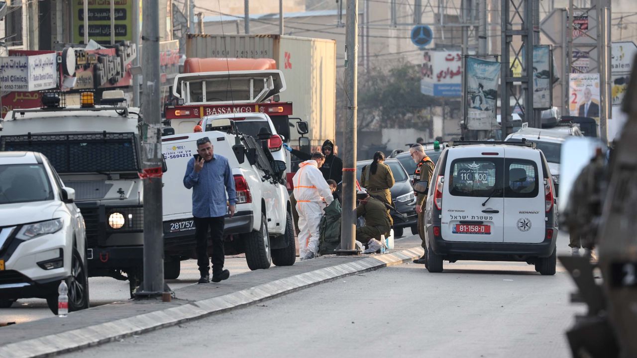Israeli security forces  respond to the scene of the shooting attack that killed the Yaniv brothers.