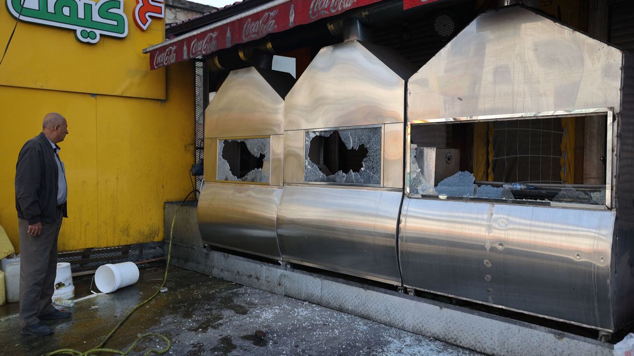 A man inspects the damage to a restaurant following a reported attack by Israeli settlers in Huwara on March 28.