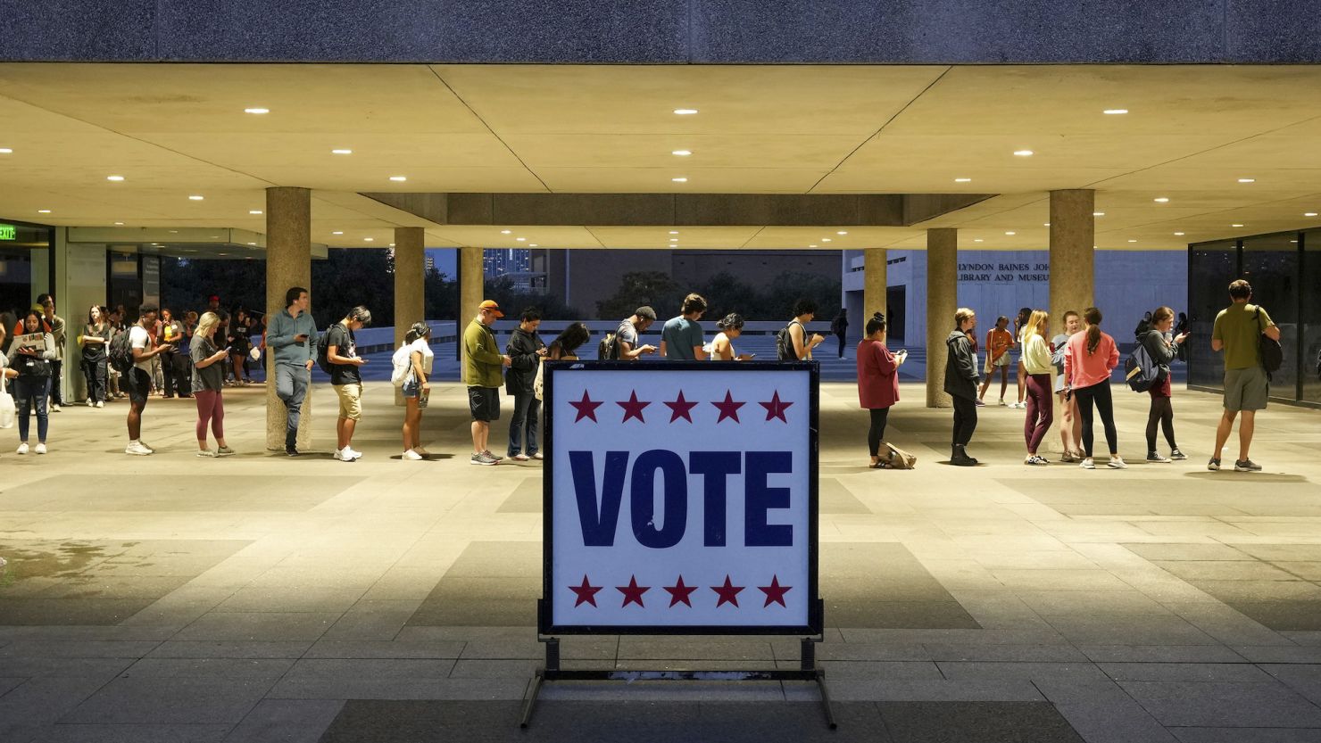 Voters wait in line at a polling place at the Lyndon B. Johnson School of Public Affairs in Austin, Texas, on election night Nov. 8, 2022.