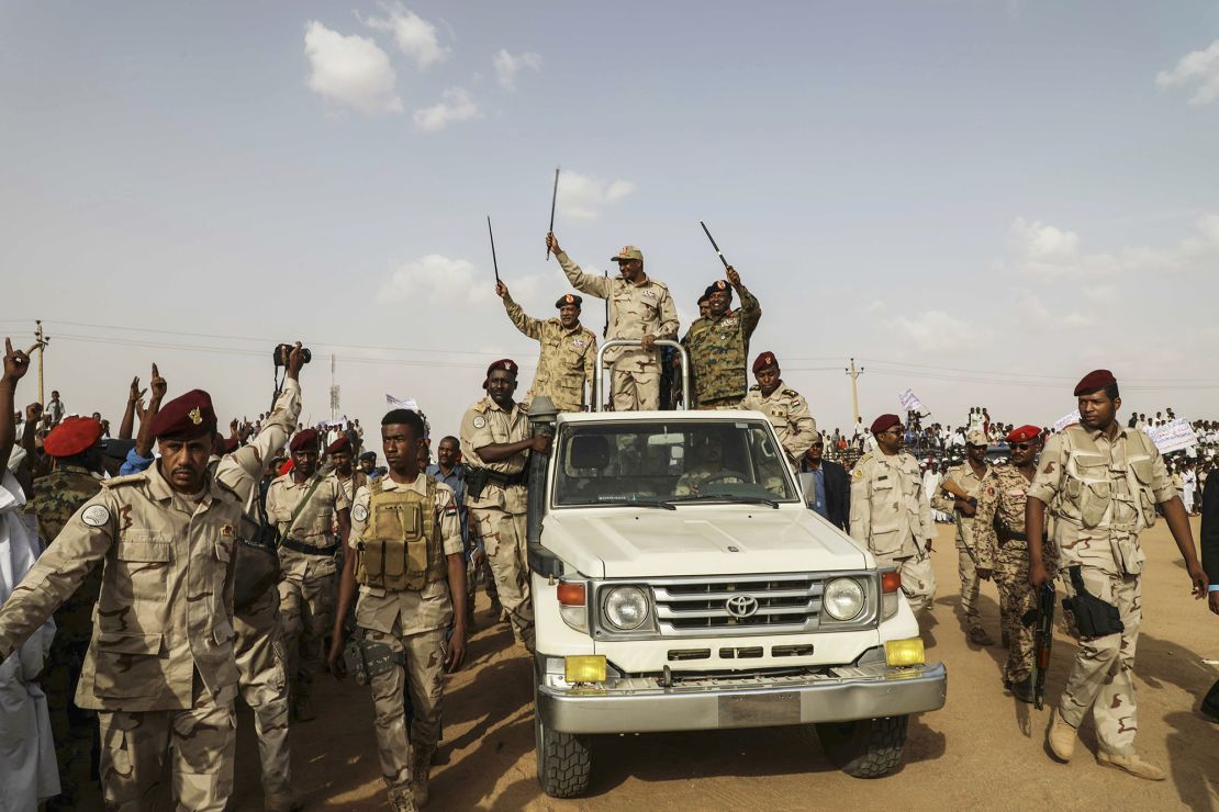 Gen. Mohamed Hamdan Dagalo (Hemedti) waves to a crowd during a rally in the Nile River State, Sudan, on July 13, 2019. 