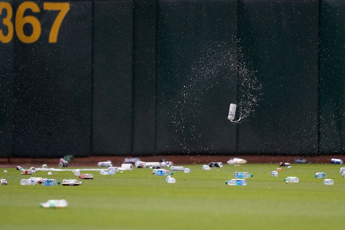 OAKLAND, CALIFORNIA - JUNE 13: Oakland Athletics fans throw garbage onto the field after a reverse boycott game at RingCentral Coliseum on June 13, 2023 in Oakland, California. (Photo by Brandon Vallance/Getty Images)