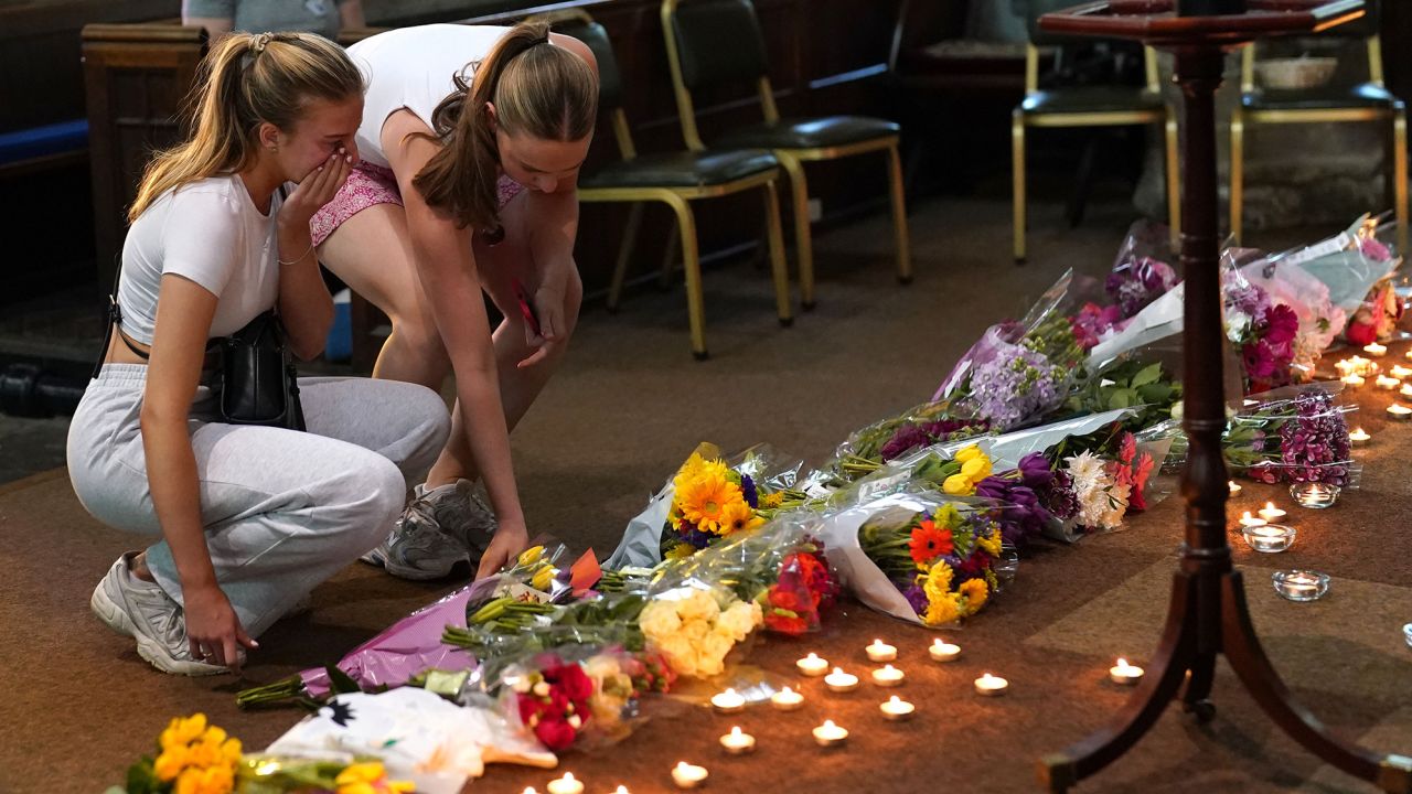 Mourners laid flowers at a vigil at St Peter's Church in Nottingham on Tuesday.