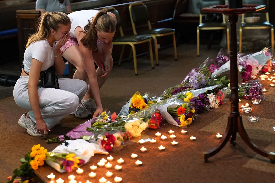 Mourners laid flowers at a vigil at St Peter's Church in Nottingham on Tuesday.