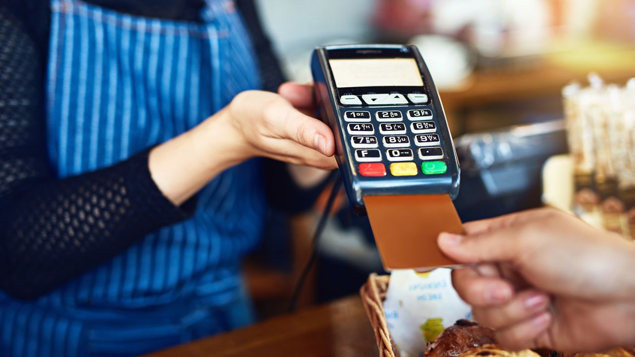 Cropped shot of an unrecognizable man paying for his purchase by card