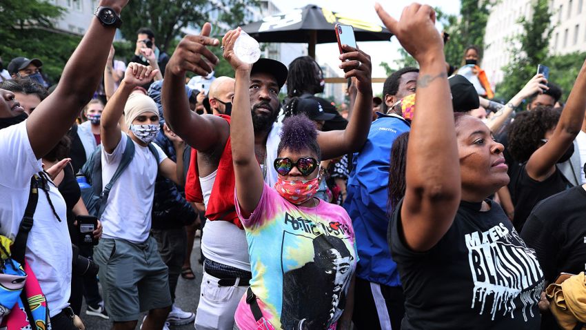 WASHINGTON, DC - JUNE 19: People dance to live Go-go music at the intersection of H St NW and 16th Street NW near the White House, an area renamed Black Lives Matter Plaza, while celebrating the Juneteenth holiday June 19, 2020 in Washington, DC. Juneteenth commemorates June 19, 1865, when a Union general read orders in Galveston, Texas stating all enslaved people in Texas were free according to federal law, effectively ending slavery in what remained of the Confederacy. (Photo by Chip Somodevilla/Getty Images)