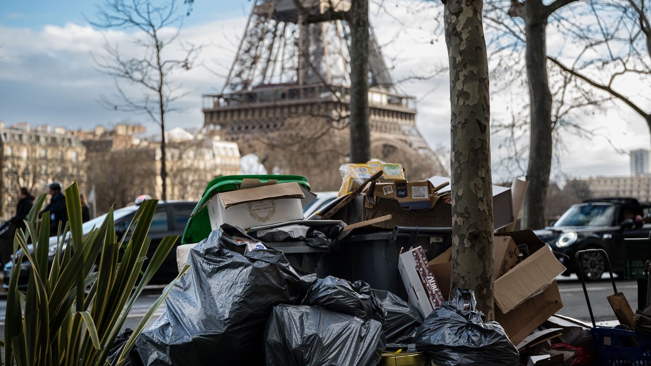 PARIS, FRANCE - MARCH 14: Piled up rubbish bags are left on the street in front of to Eiffel Tower, during the garbage collectors' strike on March 14, 2023 in Paris, France. On the ninth day of the garbage collectors' strike against the pension reform, garbage cans are piling up in Paris, dozens of filled garbage bags are piled up in the middle of the street. On tuesday, the town hall of Paris counted more than 5,600 tons of uncollected waste.  (Photo by Edward Berthelot/Getty Images)