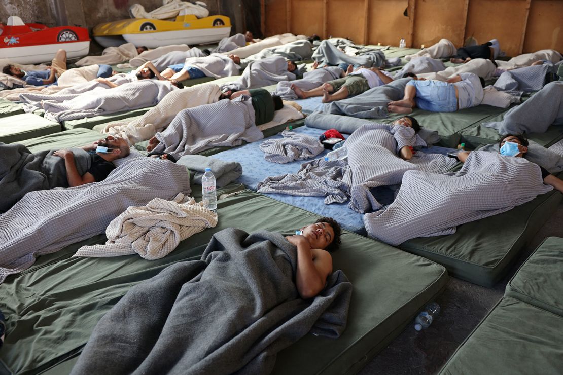 Migrants rest in a shelter, following a rescue operation, after their boat capsized at open sea, in Kalamata, Greece, June 14, 2023.