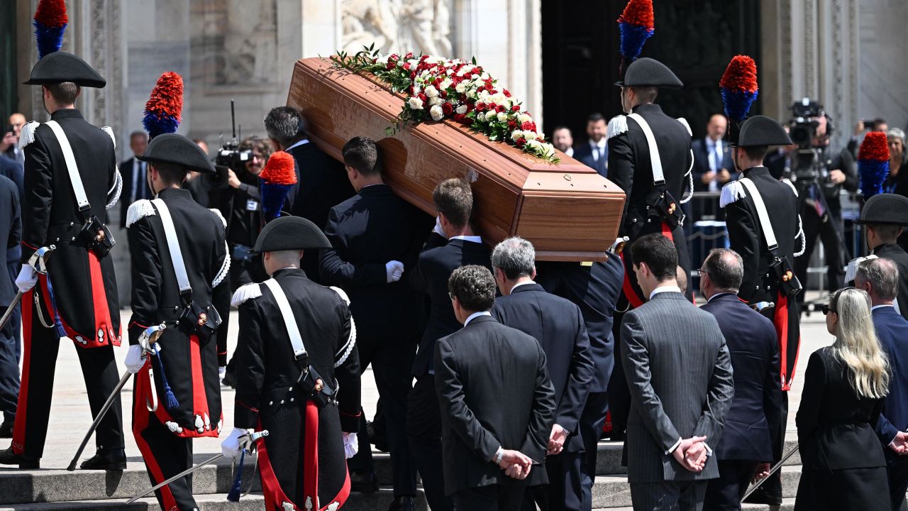 Pallbearers, followed by family members, carry the coffin of Italy's former prime minister and media mogul Silvio Berlusconi in the Duomo cathedral in Milan on June 14, 2023 for the state funeral of Berlusconi. (Photo by Andreas SOLARO / AFP) (Photo by ANDREAS SOLARO/AFP via Getty Images)