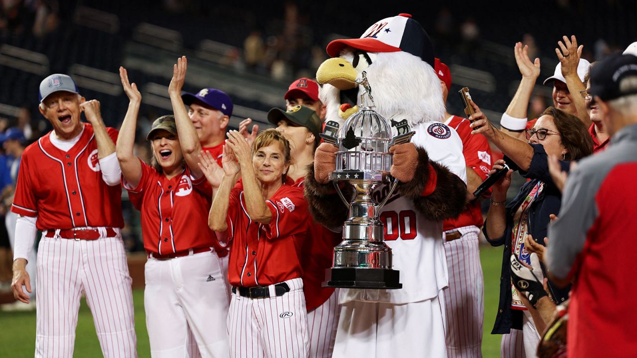 Members of the Republicans team cheer wile standing with the trophy during the annual 