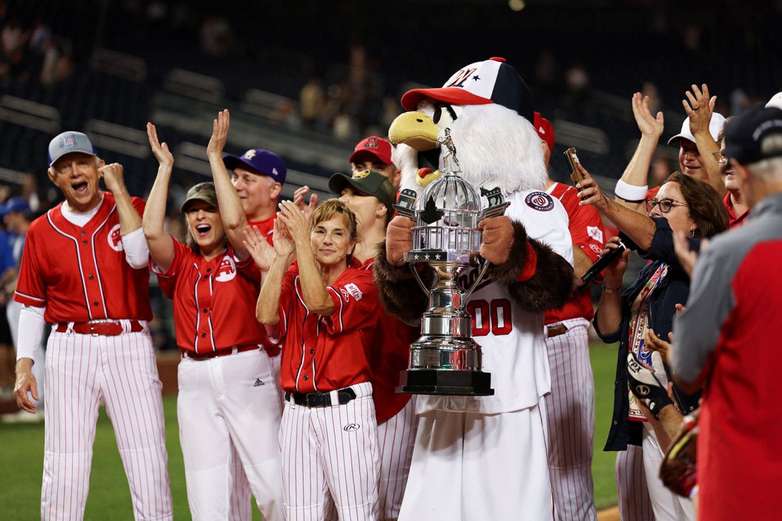 Members of the Republicans team cheer wile standing with the trophy during the annual "Congressional Baseball Game for Charity" at Nationals Park in Washington, U.S., June 14, 2023. REUTERS/Tom Brenner
