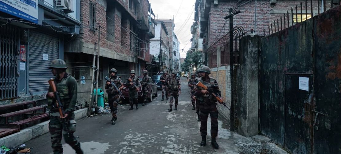 Indian army soldiers patrol the streets of Manipur on June 7, 2023.