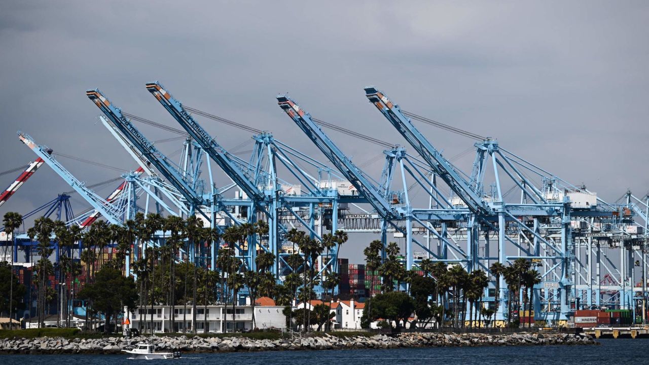 Cranes wait to unload cargo shipping containers from ships at the Port of Los Angeles in Los Angeles, California on June 7, 2023.