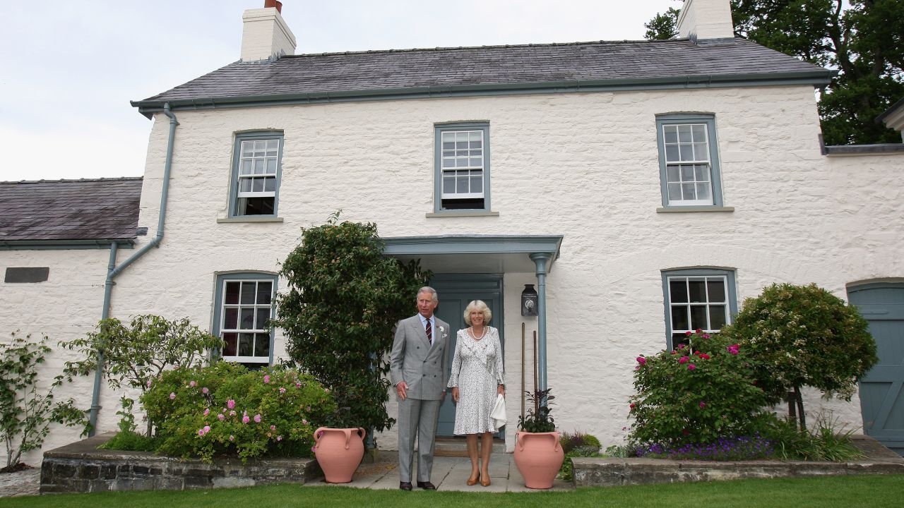 King Charles and Queen Camilla pose outside their Welsh property Llwynywermod in this file photograph before a drinks reception on 2019. 