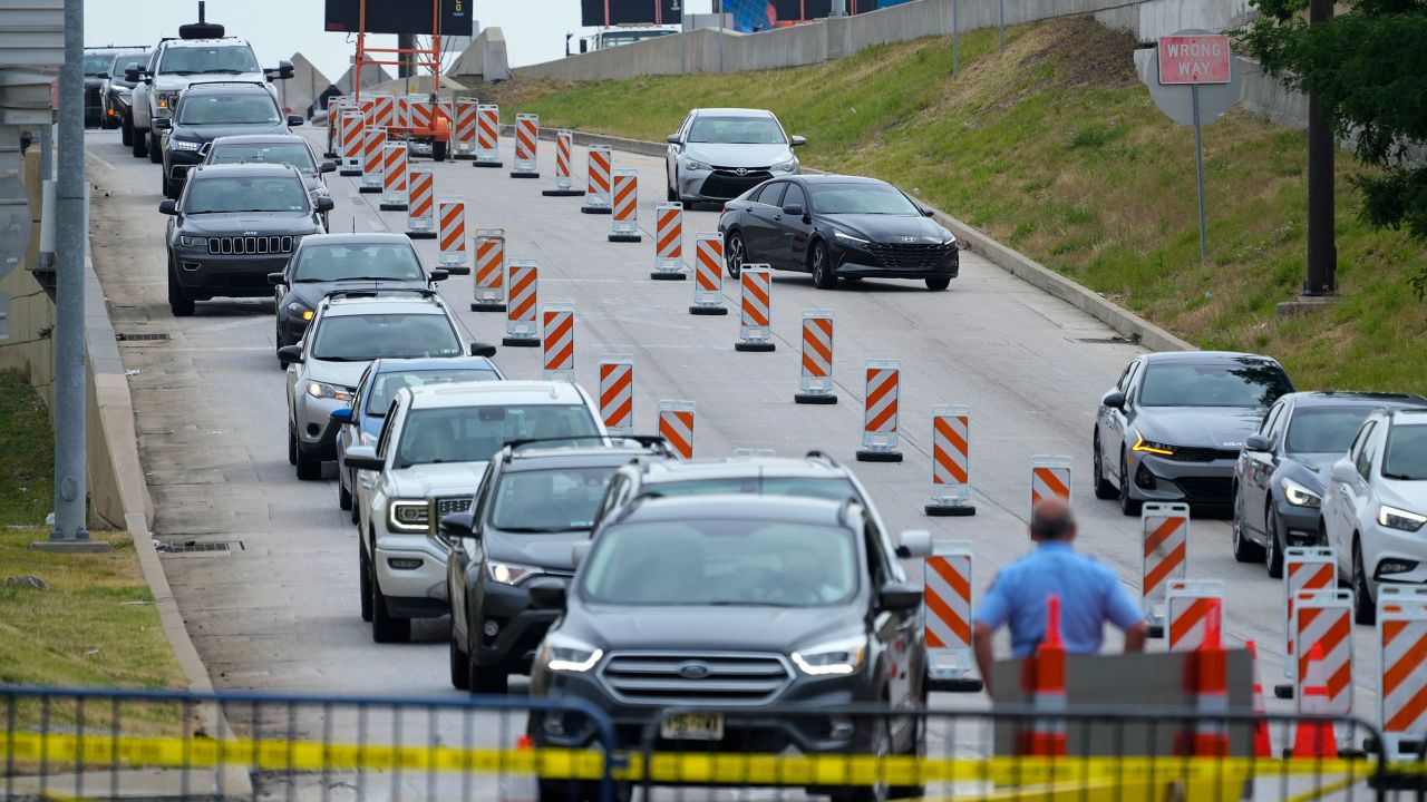 Traffic is diverted around the collapsed section of Interstate 95.