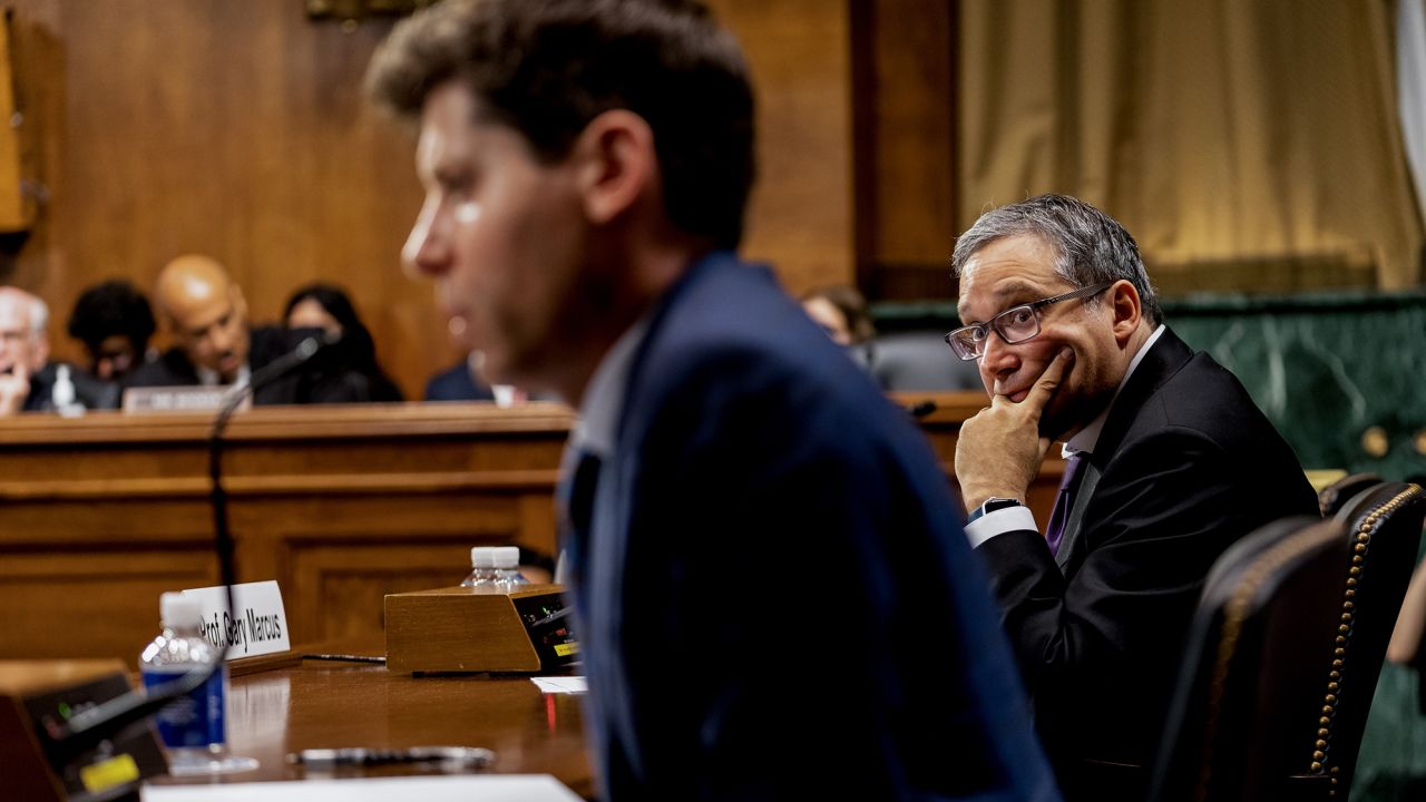 Gary Marcus, professor emeritus at New York University, right, listens to Sam Altman, chief executive officer and co-founder of OpenAI, speak during a Senate Judiciary Subcommittee hearing in Washington, DC, US, on Tuesday, May 16, 2023. Congress is debating the potential and pitfalls of artificial intelligence as products like ChatGPT raise questions about the future of creative industries and the ability to tell fact from fiction.