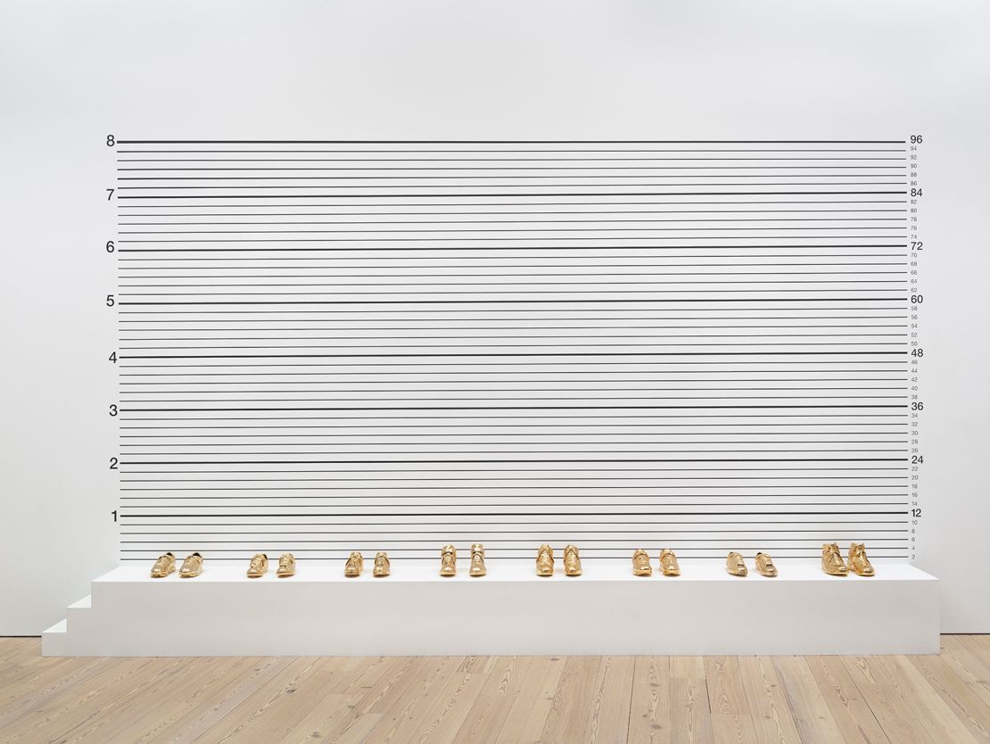 Gary Simmons (b. 1964, New York, NY; lives in Los Angeles, CA)
Lineup, 1993
Screenprint with gold-plated basketball shoes
114 × 216 × 18 in. (289.6 × 548.6 × 45.7 cm)
Whitney Museum of American Art, New York; purchase with funds from the Brown Foundation, Inc., 93.65a-p
© Gary Simmons