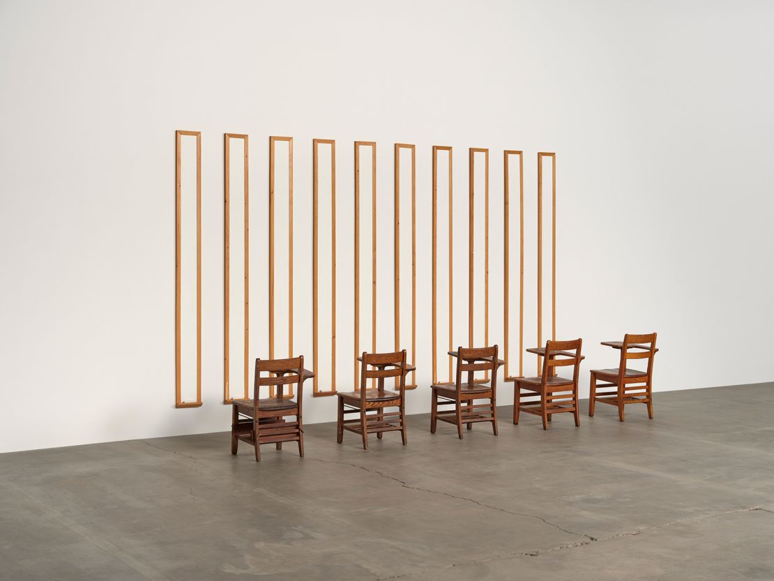 Disinformation Supremacy Board, 1989 
Ten white boards and five desks 
104 × 154 × 50 in. (264.2 × 391.2 × 127 cm)
Courtesy the artist and Hauser & Wirth
© Gary Simmons