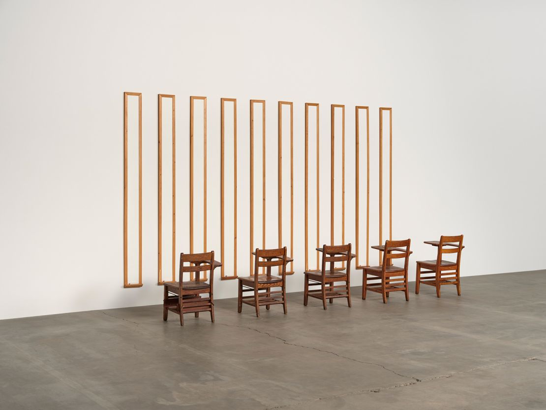 Disinformation Supremacy Board, 1989 
Ten white boards and five desks 
104 × 154 × 50 in. (264.2 × 391.2 × 127 cm)
Courtesy the artist and Hauser & Wirth
? Gary Simmons