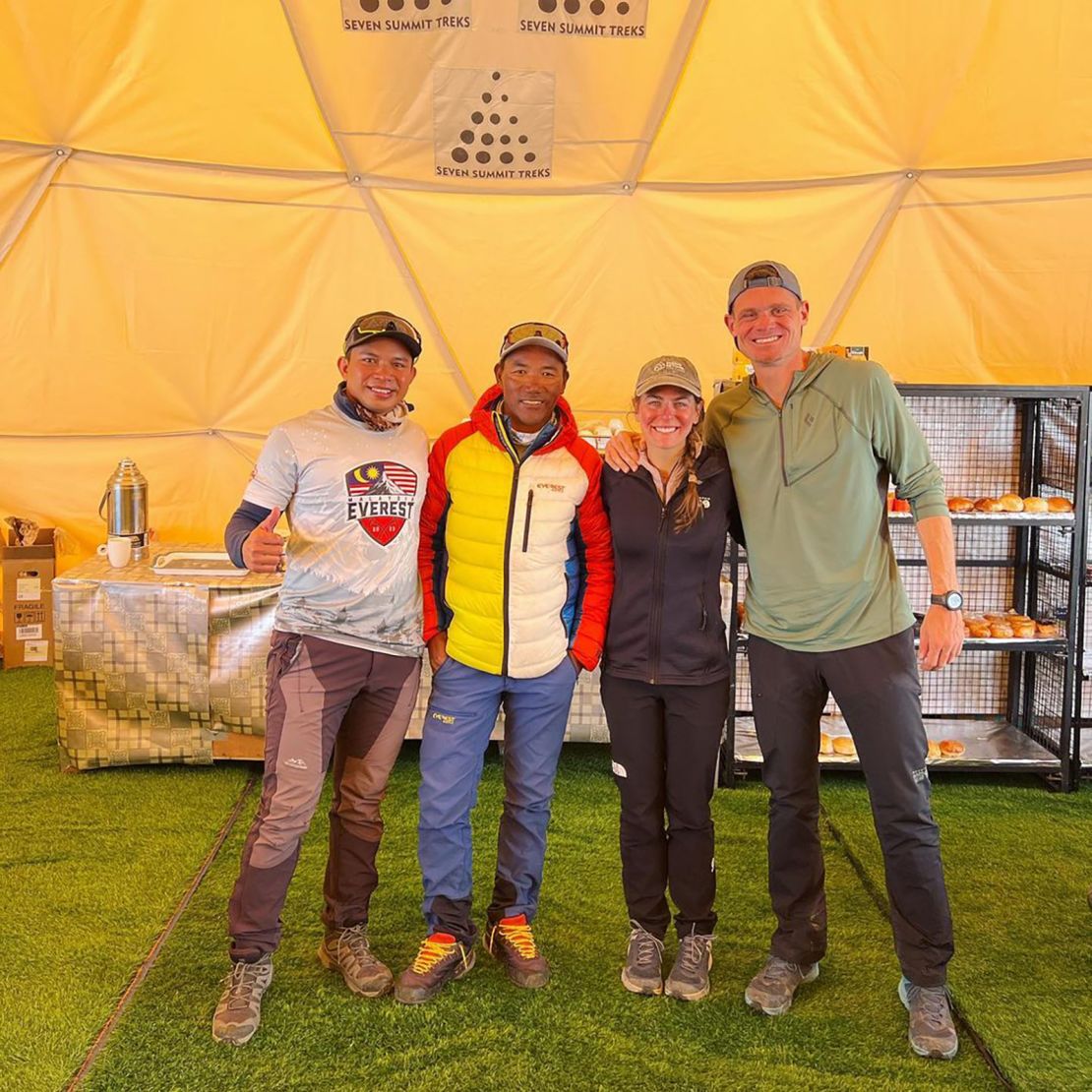 Muhammad Hawari Hashim (far left), a Sherpa guide, Shayna Unger, and Scott Lehmann at Everest base camp.