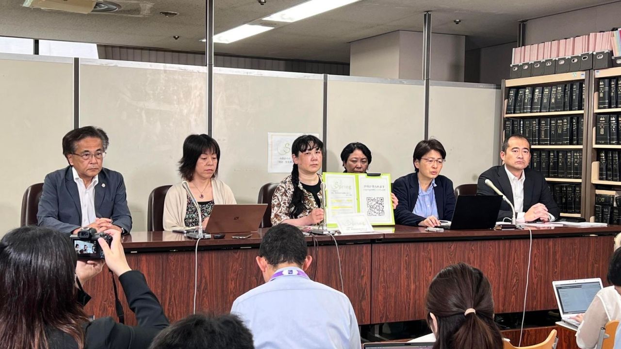 Members of Spring, with Kaneko Miyuki in the center, during a news conference.