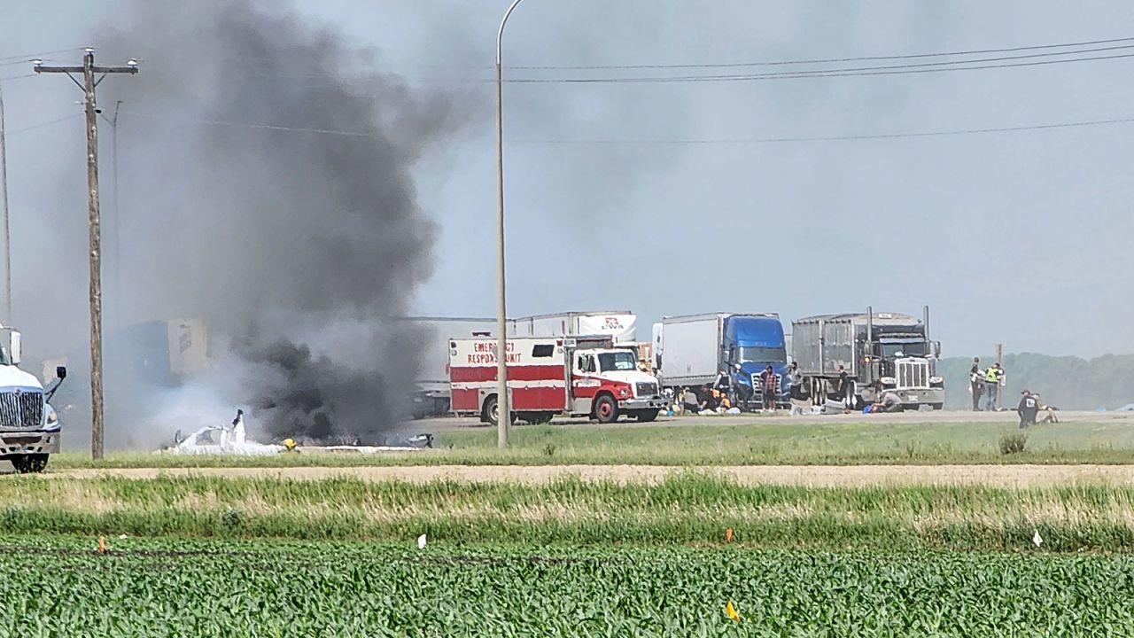 First responders are pictured following the deadly road accident near Carberry, Canada, on Thursday.